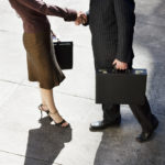 Businessman and Businesswoman Shaking Hands